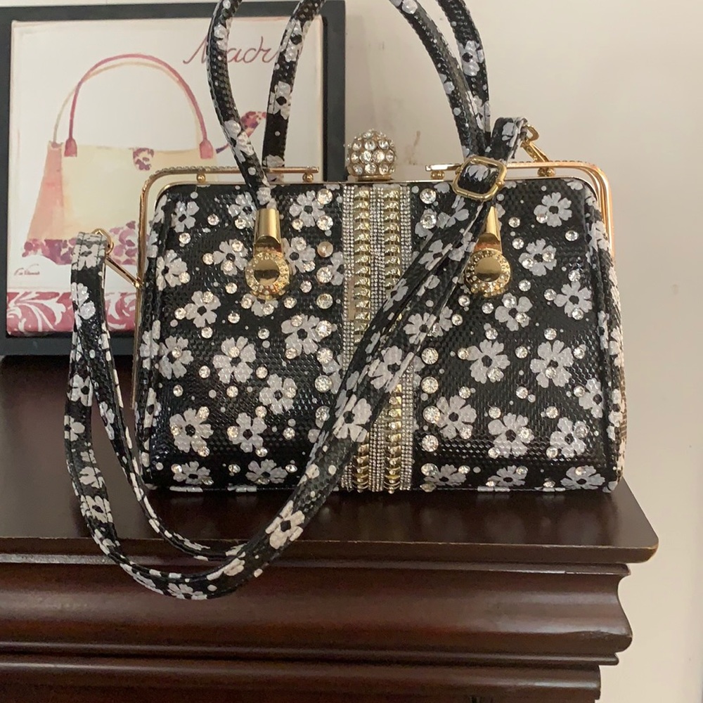 A black and white bag with gold trim.